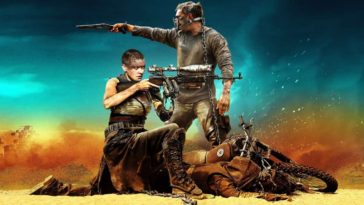 Mad Max Furry Road Wallpaper with Tom Hardy and Charlize Theron in the desert holding guns