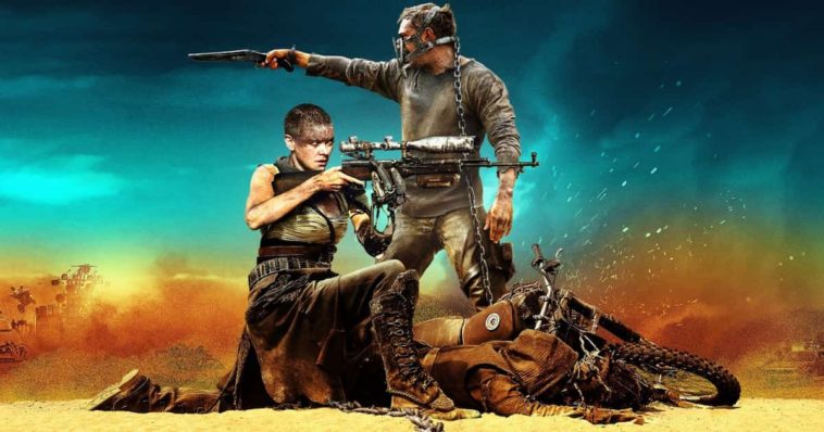 Mad Max Furry Road Wallpaper with Tom Hardy and Charlize Theron in the desert holding guns