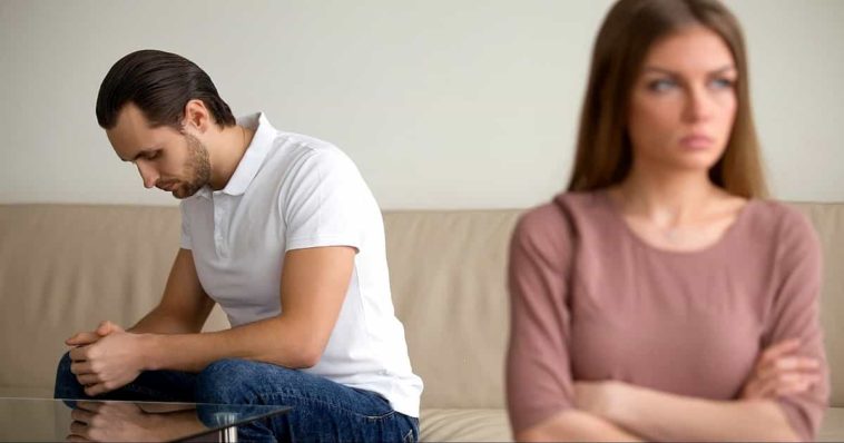A man in white T-shirt and a woman in a pink T-shirt are mad at each other
