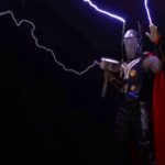 Thor cosplay guy holding electrified hammer and wearing red cape