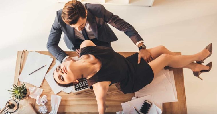 couple being erotic at workplace office